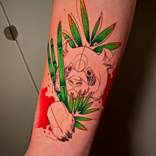 Tatouage Panda rouge et vert sur bras - Black Hat Tattoo Nice- tatouage Nice - The Black Hat Tattoo