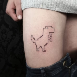 T-Rex Tatouage Pixel - Tatouage Fine Line et Line Work - Black Hat Tattoo Nice- tatouage Nice - The Black Hat Tattoo