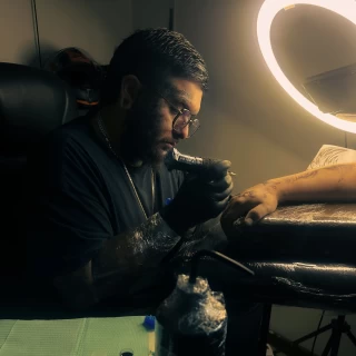 Joel - The Black Hat Tattoo